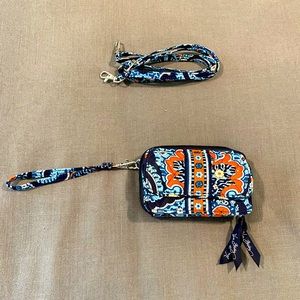 Never used, all in one cross body or wristlet mini